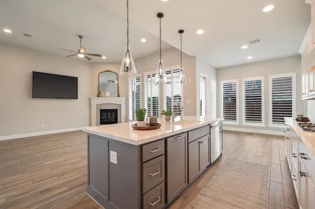 a kitchen with a stove a sink and a refrigerator