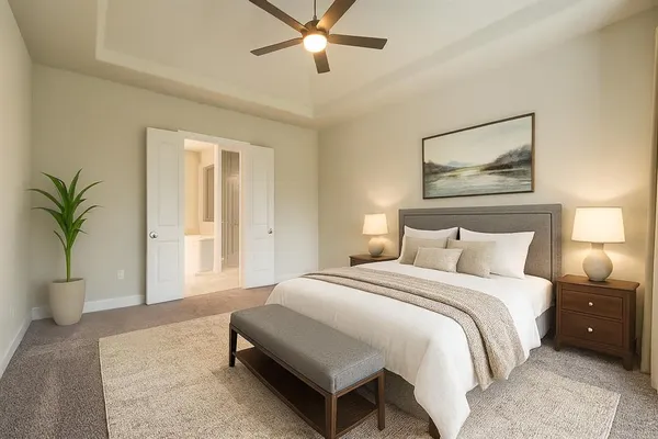 a spacious bedroom with a bed a window and potted plant