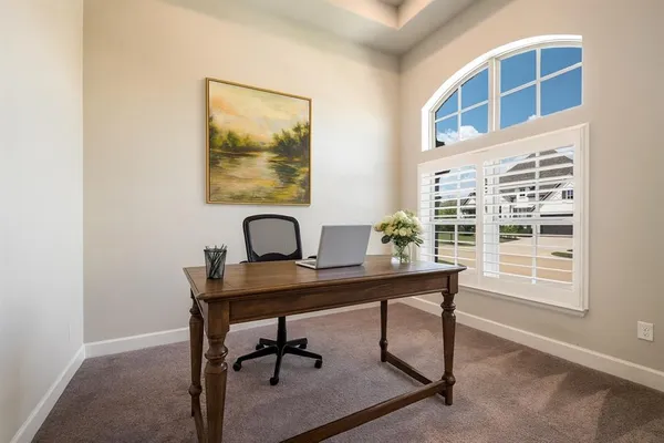 a view of a workspace with furniture