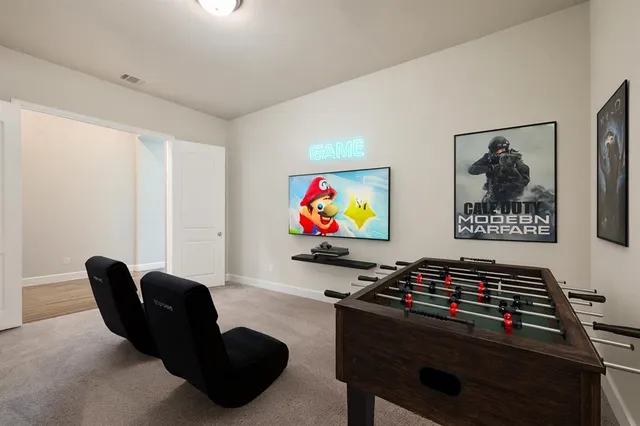 a room with furniture and wall paintings