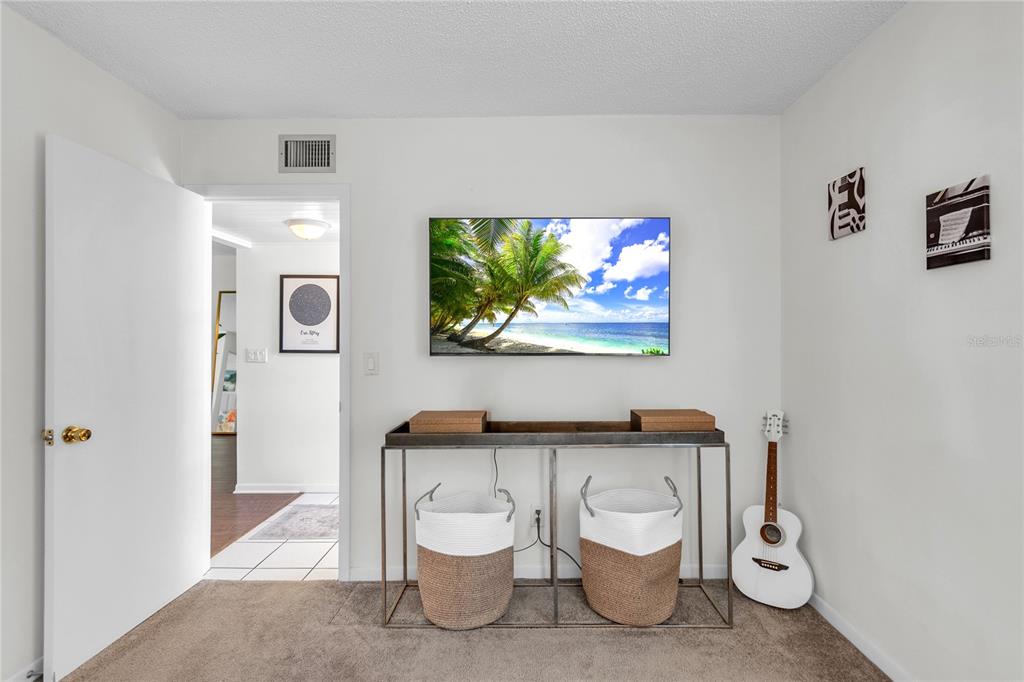 12200 Vonn Road, Unit 2206 Largo, FL 33774 - Photo 42 of 60 a white toilet sitting next to a bathroom sink