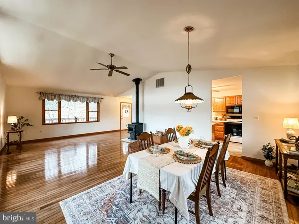 a kitchen with stainless steel appliances granite countertop a sink and cabinets