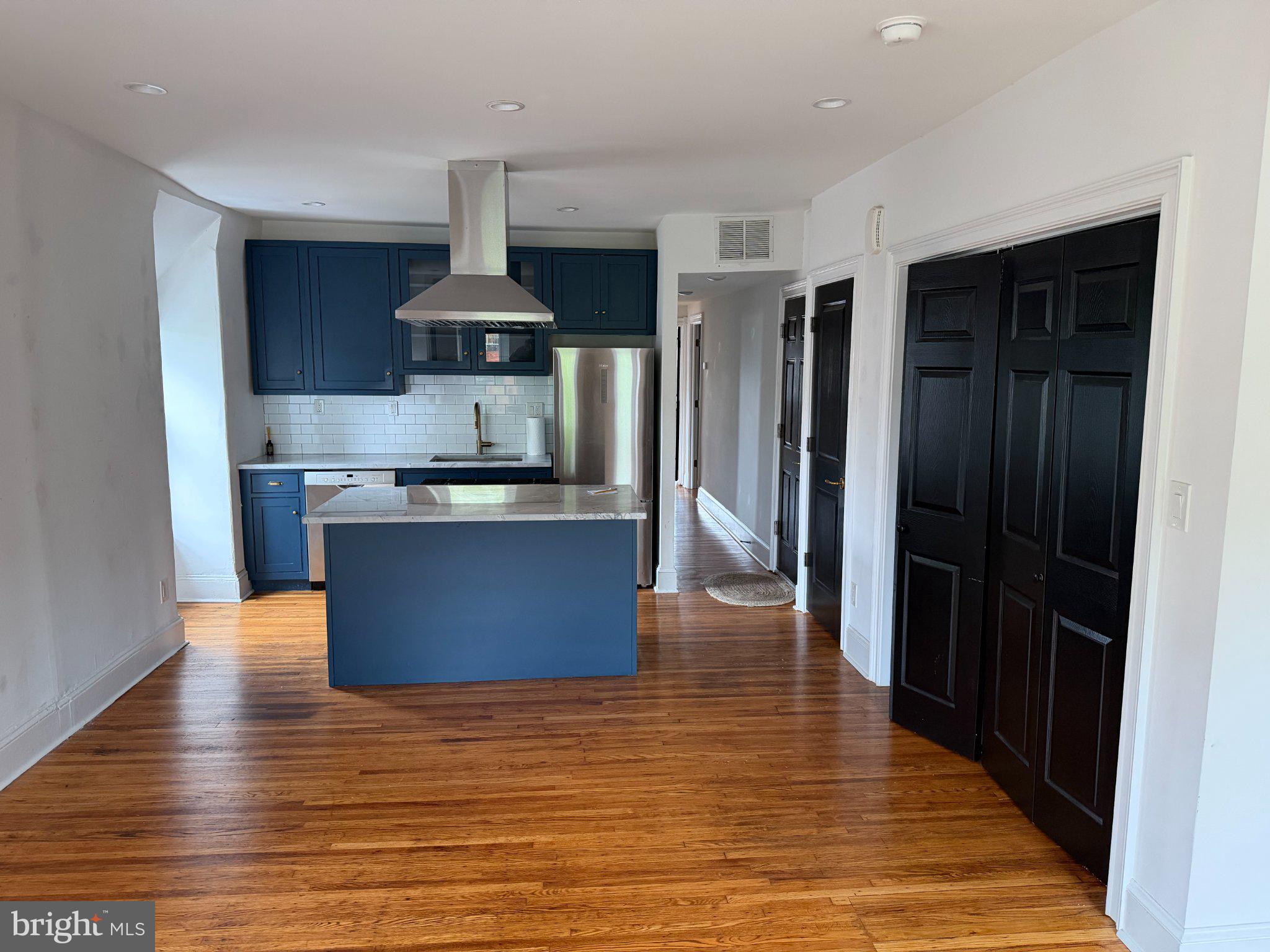 815 South 49th Street Philadelphia, PA 19143 - Photo 35 of 72 a kitchen with stainless steel appliances granite countertop a stove top oven a sink and a refrigerator