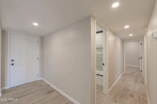 a view of a bathroom with a sink and a large mirror