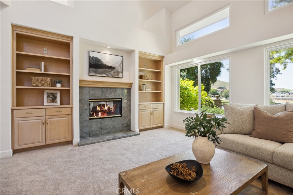 993 Las Palmas Way San Luis Obispo, CA 93401 - Photo 12 of 63 a living room with furniture potted plant and a fireplace
