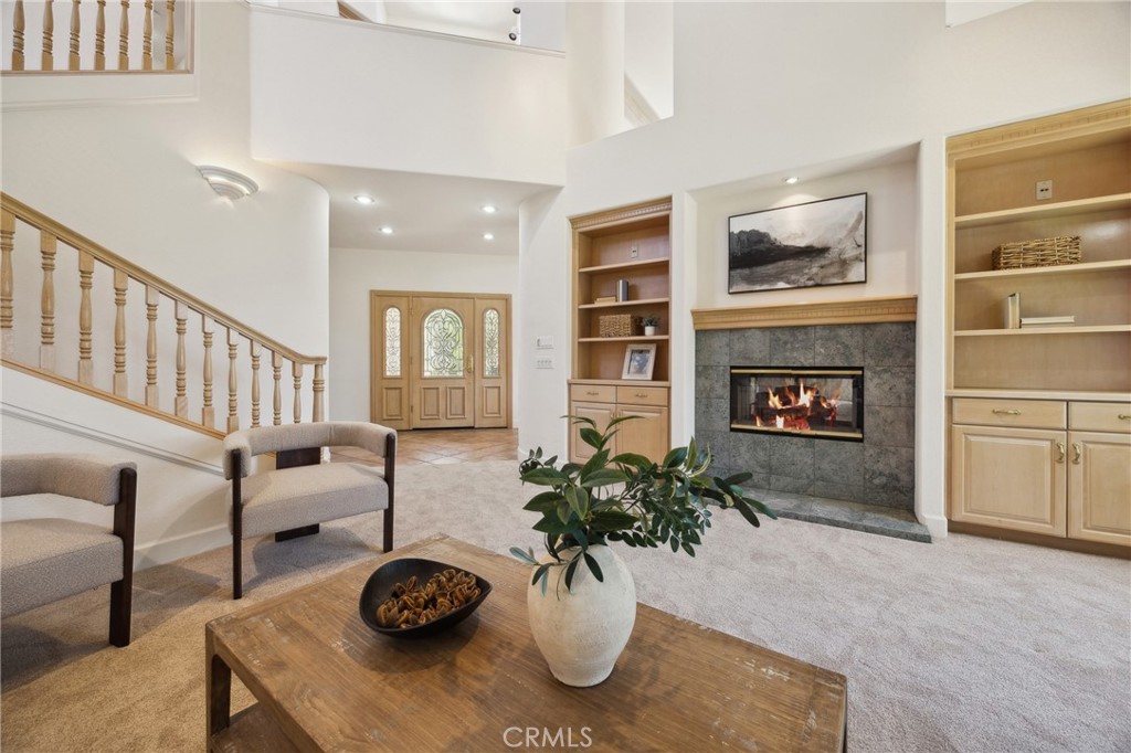 993 Las Palmas Way San Luis Obispo, CA 93401 - Photo 13 of 63 a living room with furniture potted plant and a fireplace