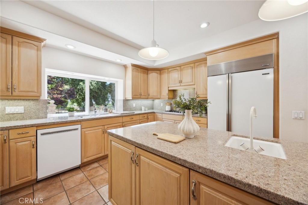 993 Las Palmas Way San Luis Obispo, CA 93401 - Photo 24 of 63 a kitchen with granite countertop a sink and a window