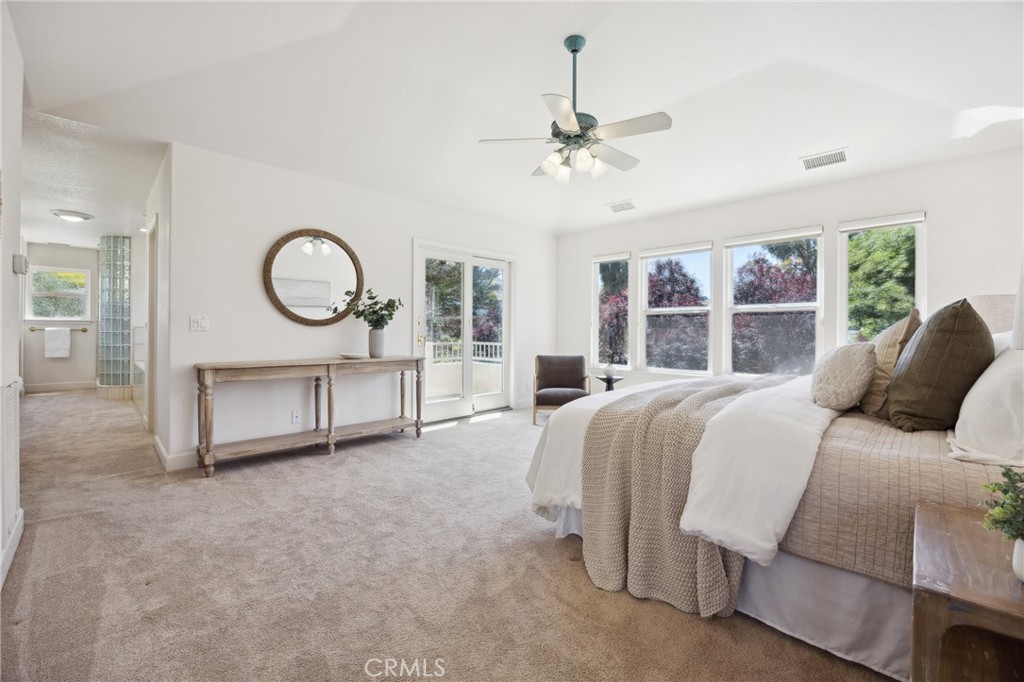 993 Las Palmas Way San Luis Obispo, CA 93401 - Photo 31 of 63 a bedroom with a large bed and a chandelier