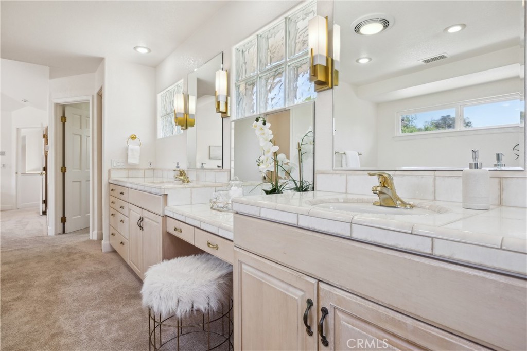 993 Las Palmas Way San Luis Obispo, CA 93401 - Photo 36 of 63 a spacious bathroom with a double vanity sink and a mirror