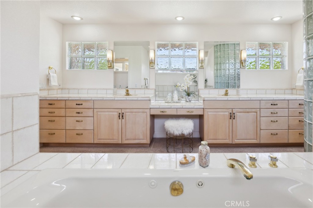 993 Las Palmas Way San Luis Obispo, CA 93401 - Photo 37 of 63 a spacious bathroom with a tub sink and mirror