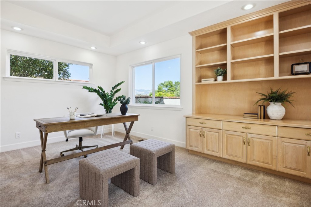993 Las Palmas Way San Luis Obispo, CA 93401 - Photo 50 of 63 a kitchen with a table chairs and white cabinets
