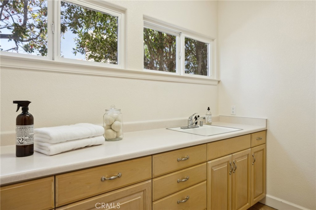 993 Las Palmas Way San Luis Obispo, CA 93401 - Photo 52 of 63 a bathroom with a sink and mirror