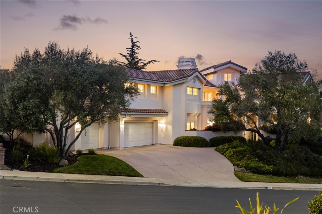 993 Las Palmas Way San Luis Obispo, CA 93401 - Photo 59 of 63 a front view of a house with a yard and trees