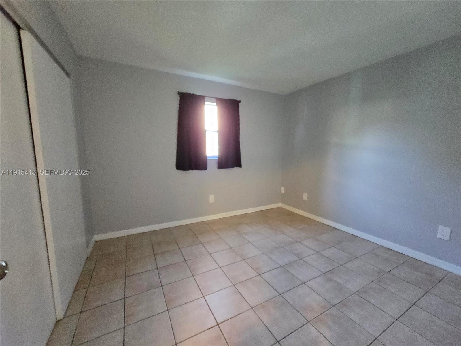4550 Southeast Salvatori Road Stuart, FL 34997 - Photo 5 of 13 a view of an empty room and window