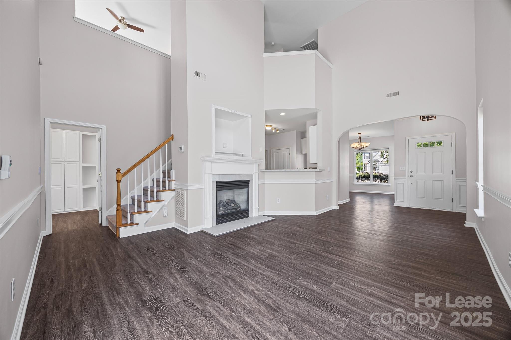 2535 Fossil Stone Lane Fort Mill, SC 29708 - Photo 12 of 43 a view of an empty room with wooden floor and a fireplace
