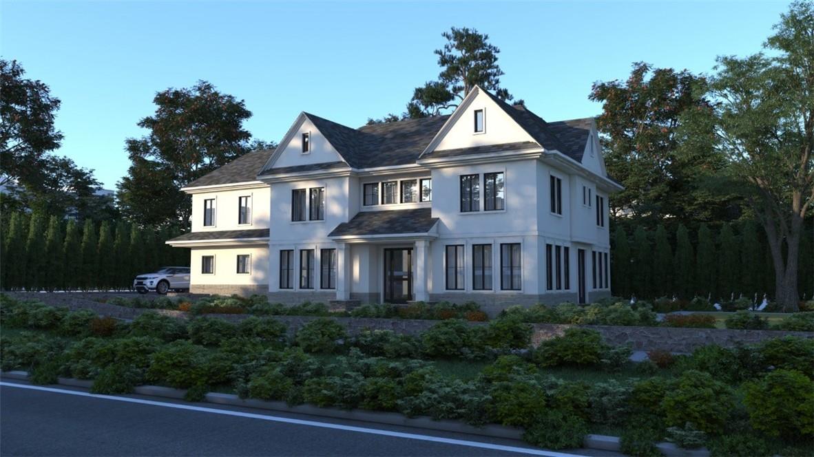 a front view of a house with plants and trees