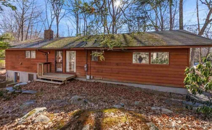 58 Candide Lane Mansfield, CT 06268 - Photo 2 of 3 a view of a house with a yard