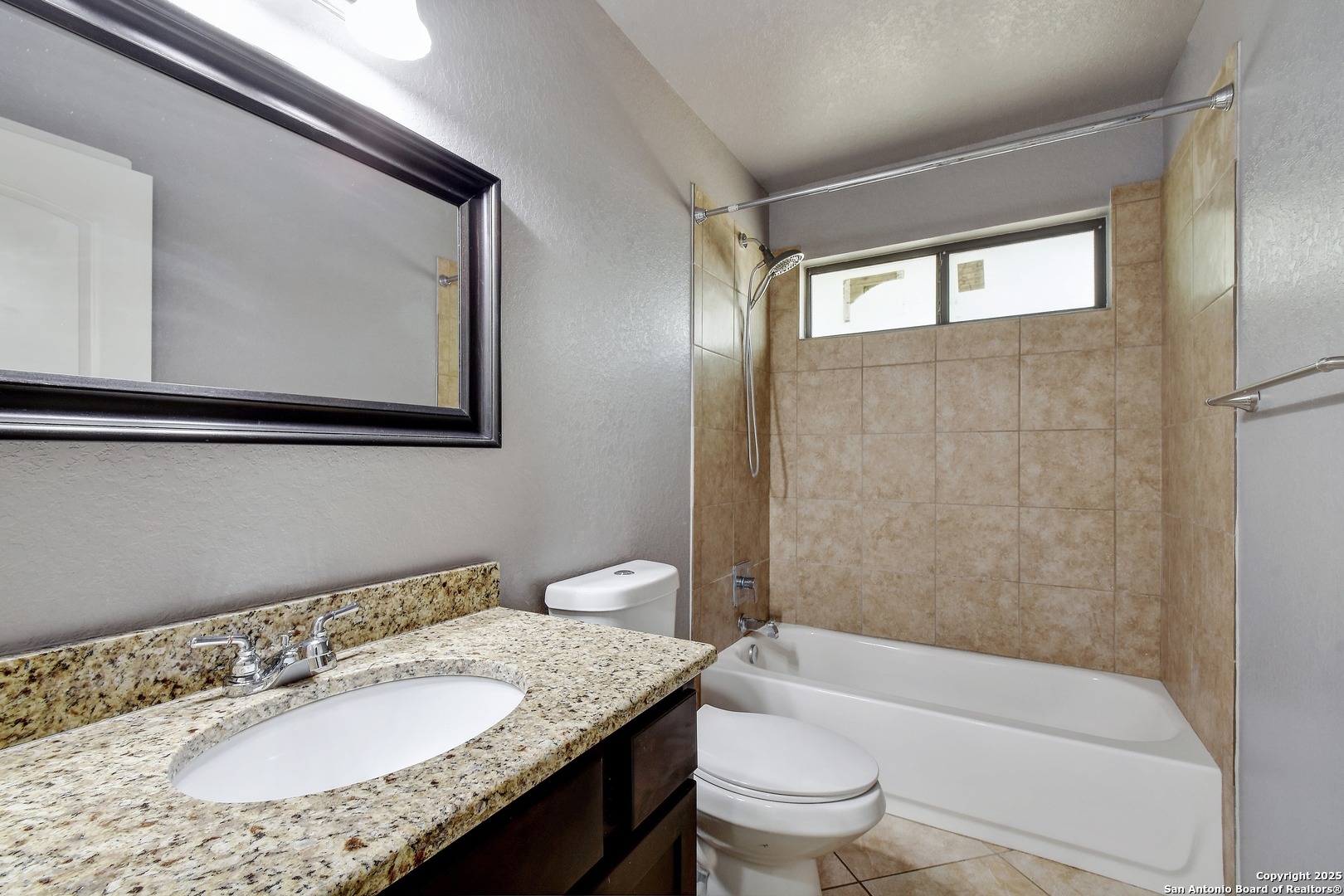 1010 Persimmon Pass Fischer, TX 78623 - Photo 20 of 26 a bathroom with a granite countertop sink toilet and shower