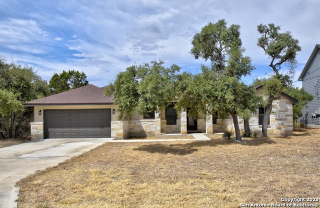 1010 Persimmon Pass Fischer, TX 78623 - Photo 2 of 26 a front view of a house with a yard