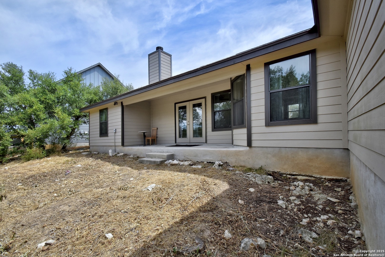 1010 Persimmon Pass Fischer, TX 78623 - Photo 25 of 26 a front view of a house with a yard