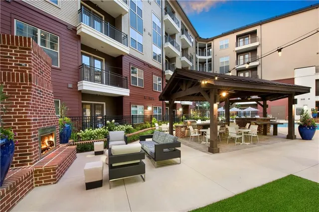 a view of a building with sitting area
