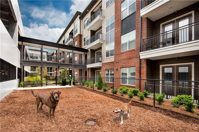a view of a building with a yard