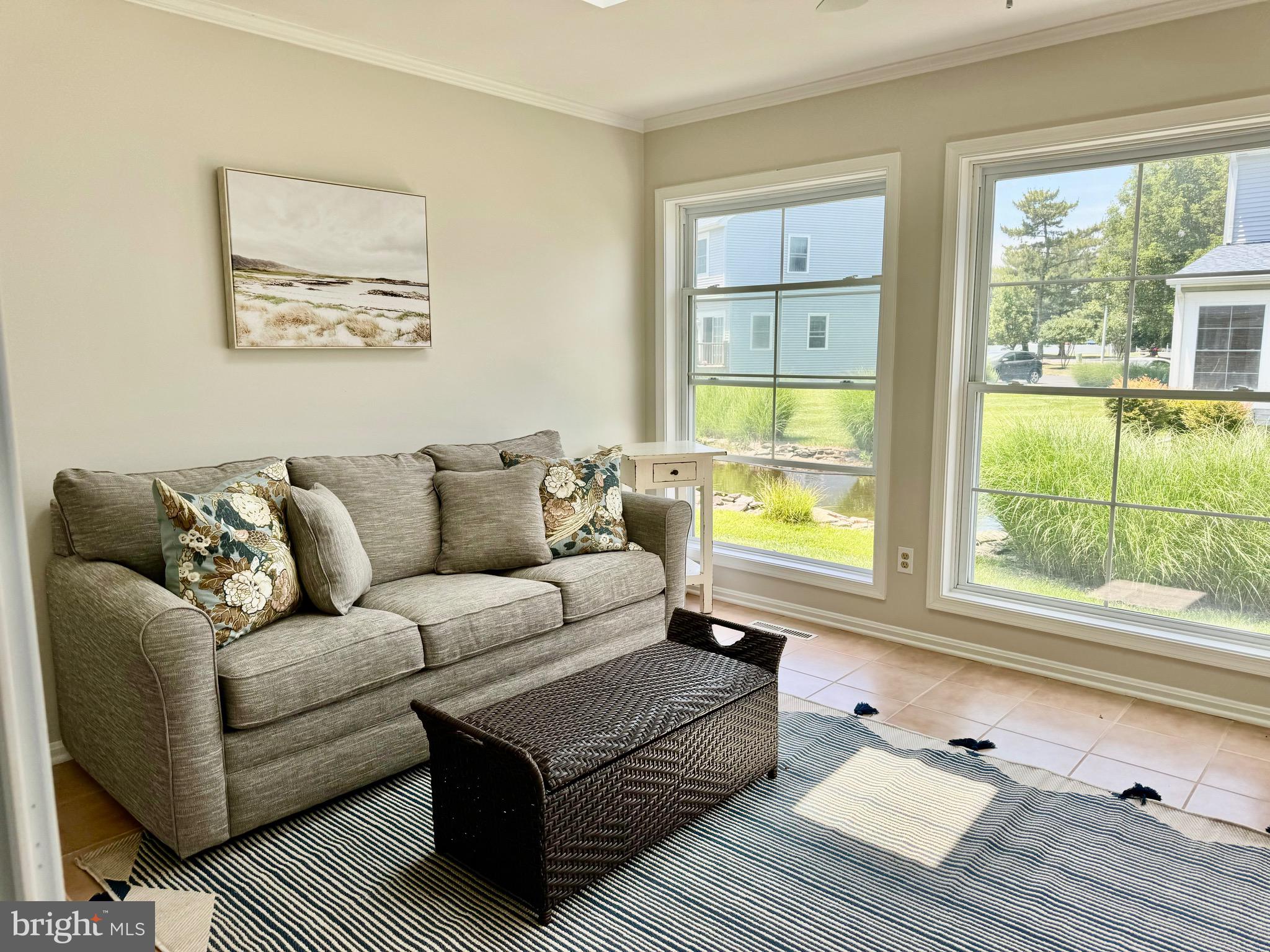 280 American Eagle Way, Unit 2806 Rehoboth Beach, DE 19971 - Photo 13 of 41 a living room with furniture and a window