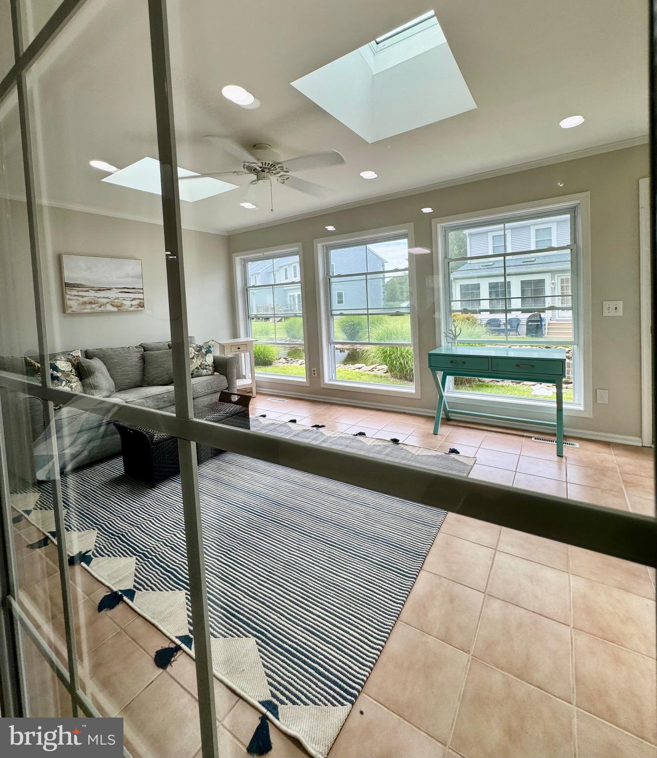 280 American Eagle Way, Unit 2806 Rehoboth Beach, DE 19971 - Photo 14 of 41 a lobby with a couch and a large window