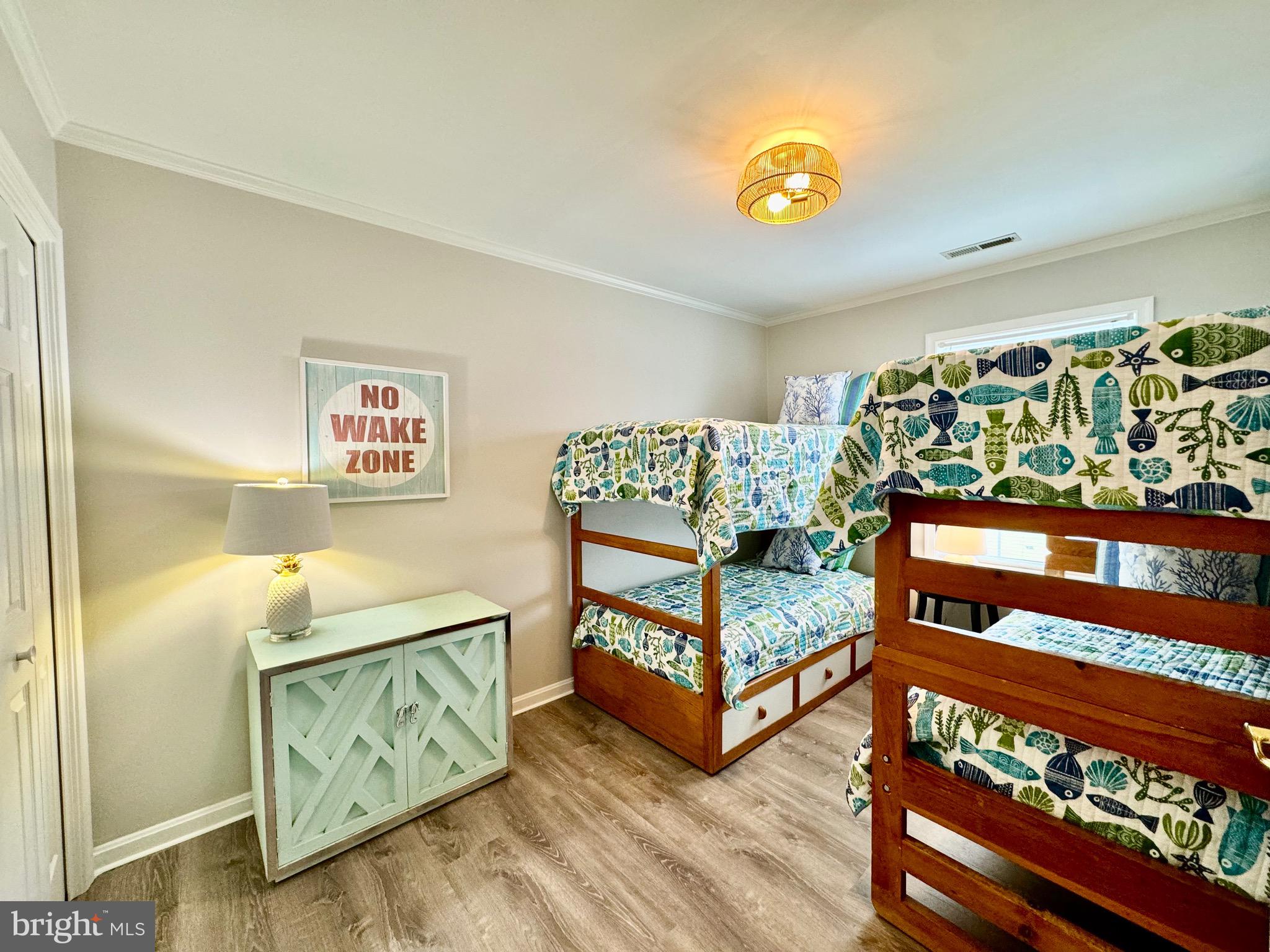 280 American Eagle Way, Unit 2806 Rehoboth Beach, DE 19971 - Photo 21 of 41 a bedroom with bed and a window