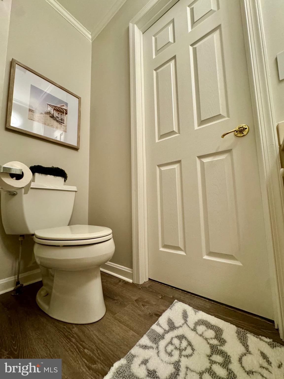 280 American Eagle Way, Unit 2806 Rehoboth Beach, DE 19971 - Photo 25 of 41 a white toilet sitting next to a bathroom