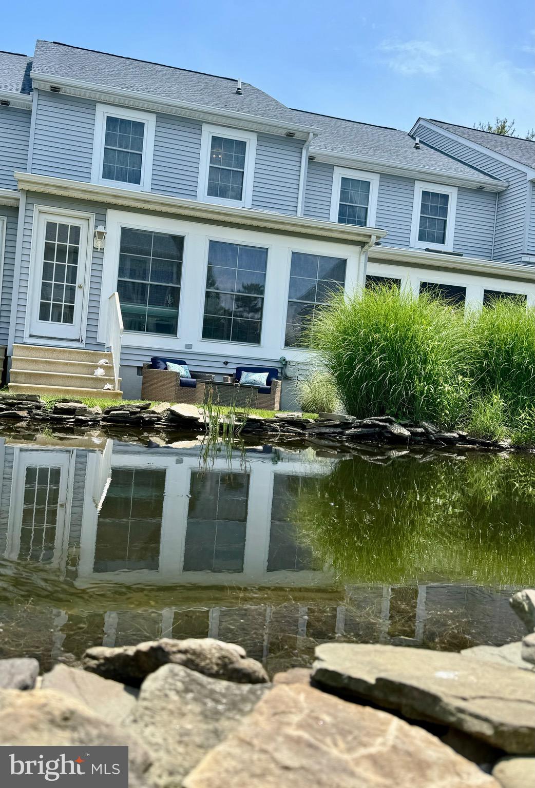 280 American Eagle Way, Unit 2806 Rehoboth Beach, DE 19971 - Photo 29 of 41 a front view of a house with a yard