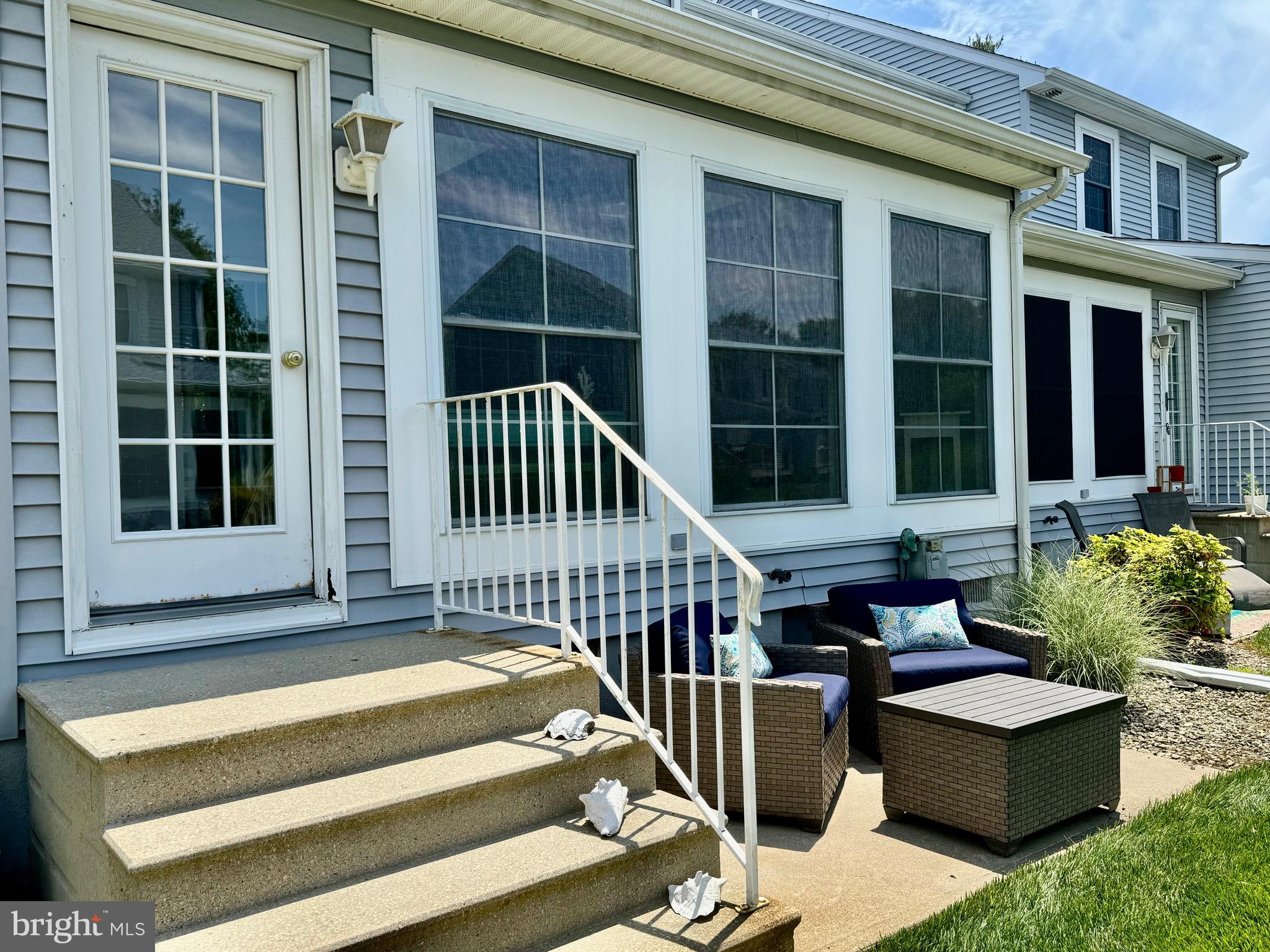 280 American Eagle Way, Unit 2806 Rehoboth Beach, DE 19971 - Photo 31 of 41 a view of a house with couches on the deck