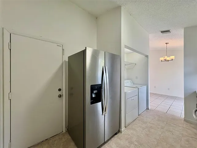a bathroom with a shower and a glass door