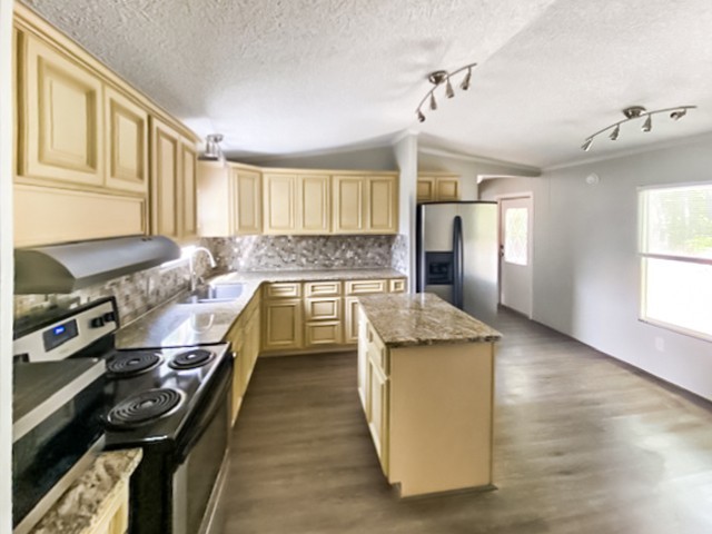 273 Running Meadows Road Portland, TN 37148 - Photo 11 of 20 a kitchen with a stove and a window