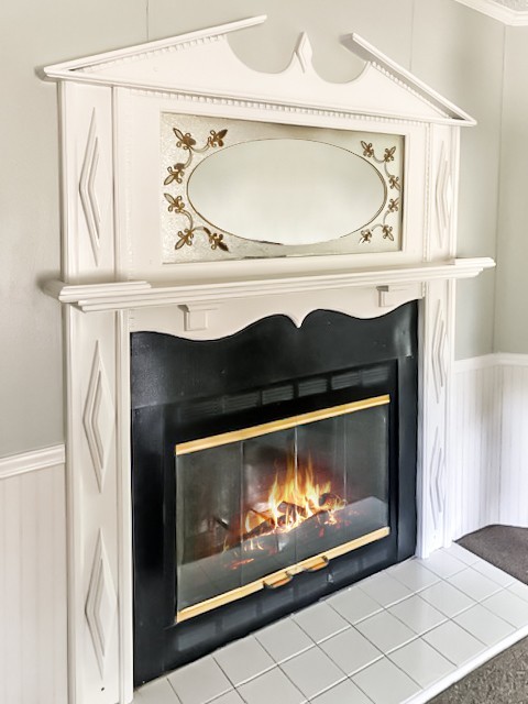 273 Running Meadows Road Portland, TN 37148 - Photo 16 of 20 a fireplace with a clock on it
