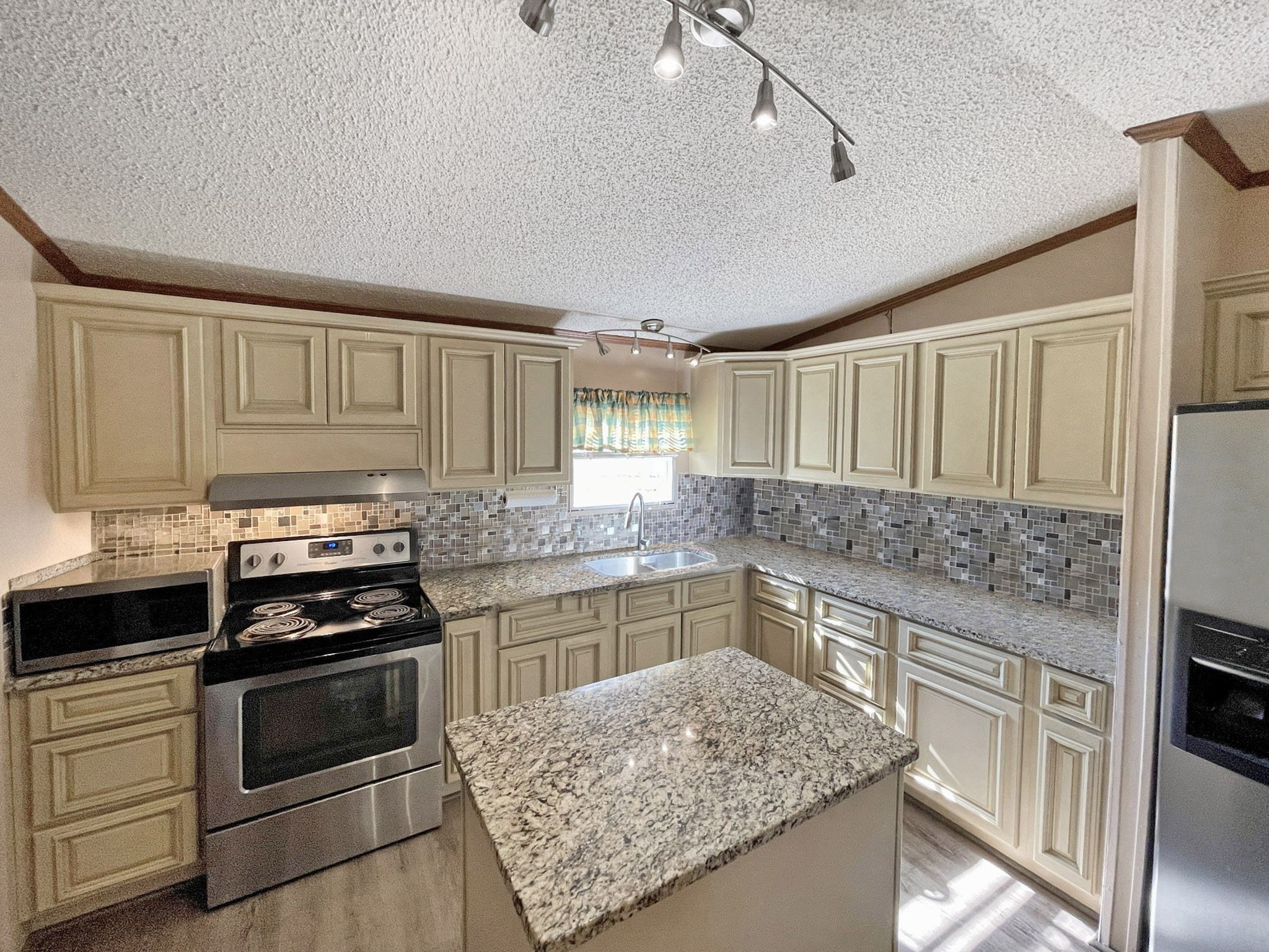 273 Running Meadows Road Portland, TN 37148 - Photo 9 of 20 a kitchen with a stove and a sink