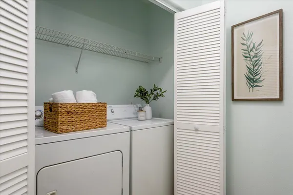 a bathroom with a granite countertop sink a toilet and mirror