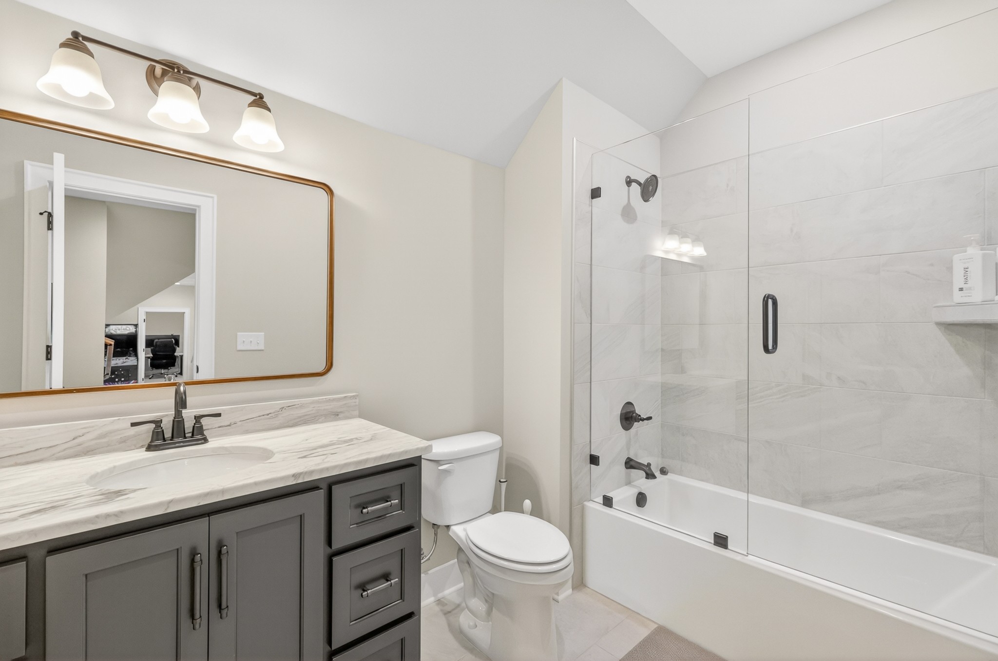 1176 Iron Bridge Road Columbia, TN 38401 - Photo 43 of 53 a bathroom with a granite countertop toilet sink and a bathtub