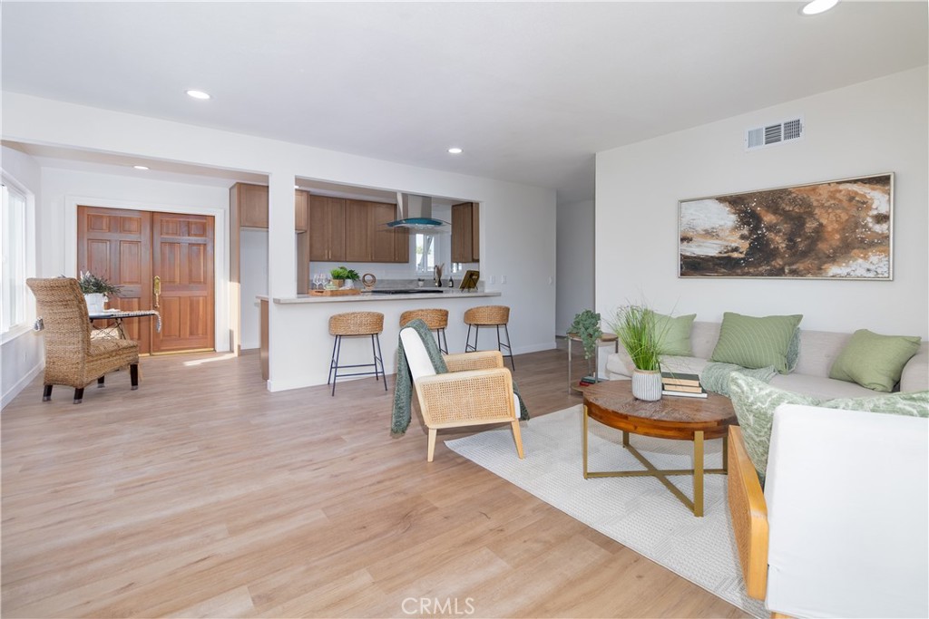 3306 Debbie Lane Riverside, CA 92501 - Photo 7 of 32 a living room with furniture and a wooden floor
