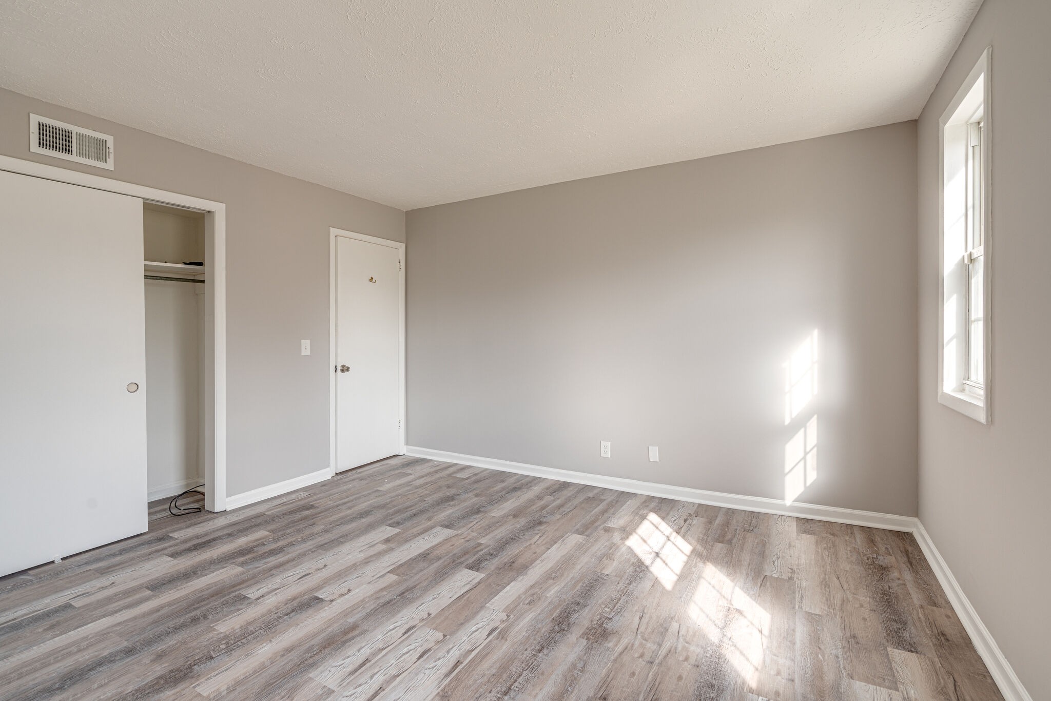 323 Forest Park Road, Unit 76 Madison, TN 37115 - Photo 12 of 15 a view of empty room with wooden floor and fan