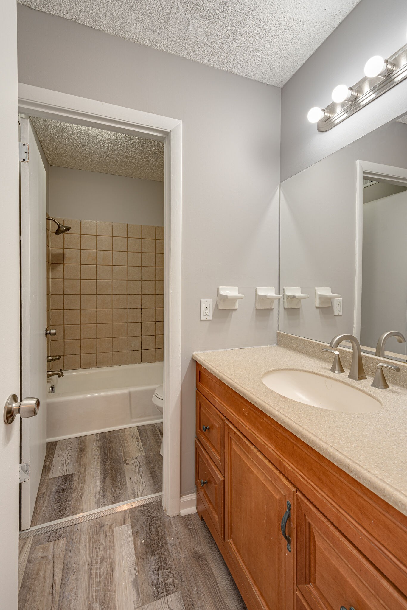 323 Forest Park Road, Unit 76 Madison, TN 37115 - Photo 13 of 15 a bathroom with a sink a toilet and shower