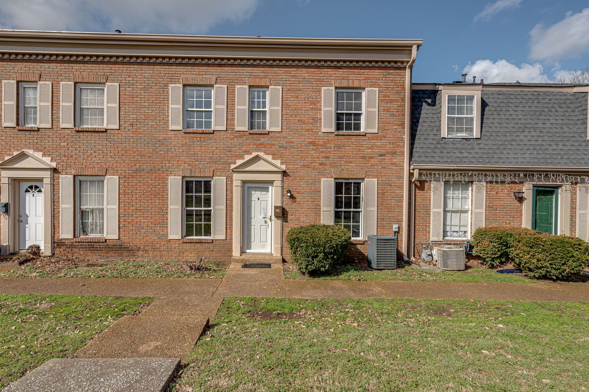 323 Forest Park Road, Unit 76 Madison, TN 37115 - Photo 15 of 15 front view of a brick house with a yard