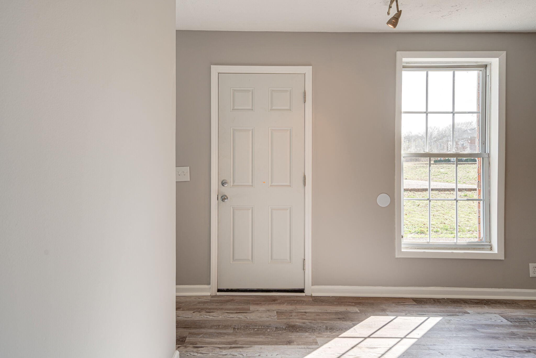 323 Forest Park Road, Unit 76 Madison, TN 37115 - Photo 3 of 15 an empty room with wooden floor and windows