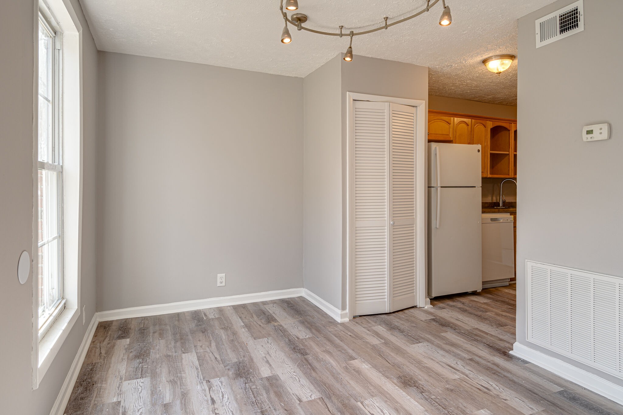 323 Forest Park Road, Unit 76 Madison, TN 37115 - Photo 4 of 15 a view of an empty room with wooden floor and a window