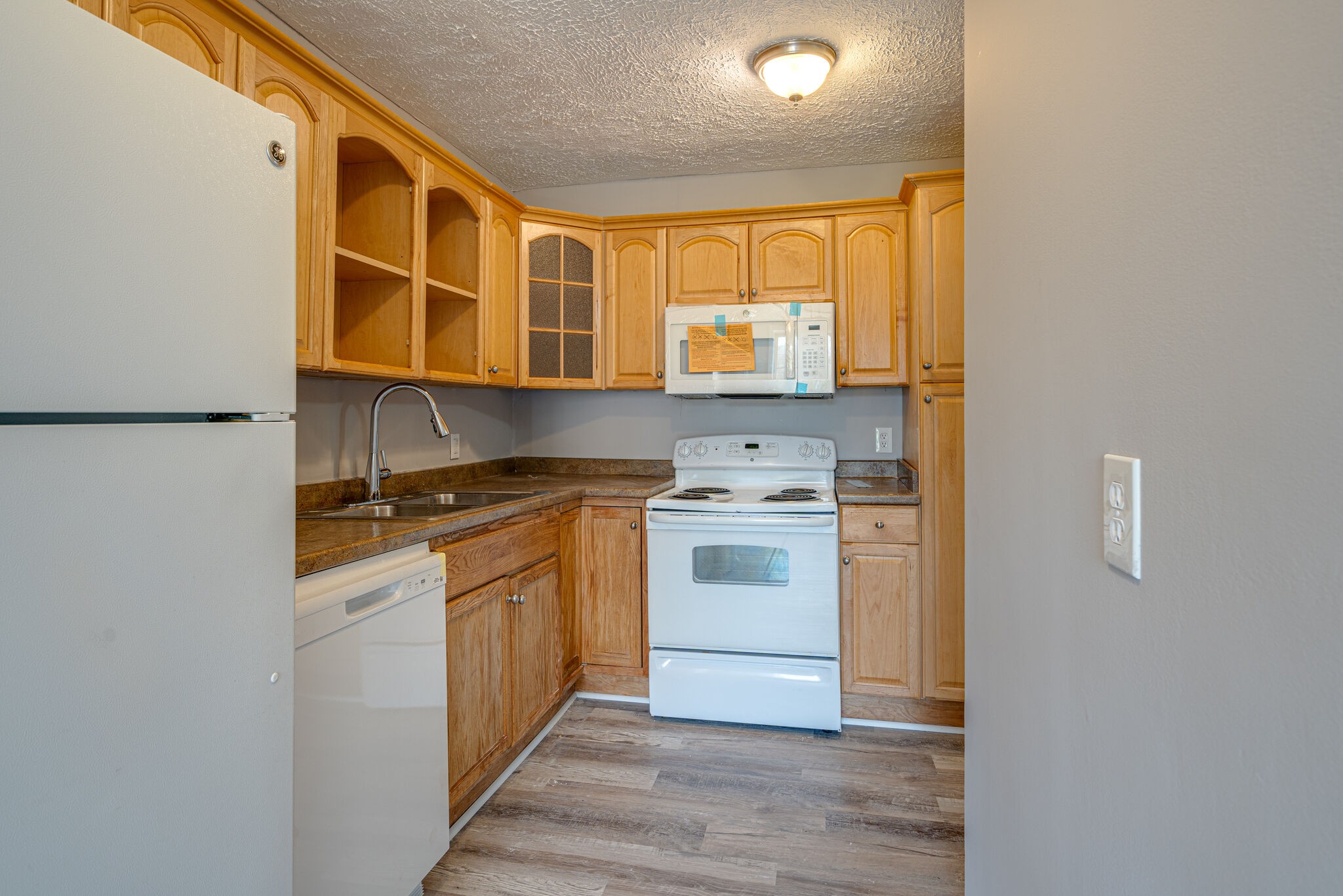 323 Forest Park Road, Unit 76 Madison, TN 37115 - Photo 6 of 15 a kitchen with stainless steel appliances granite countertop a stove and a refrigerator