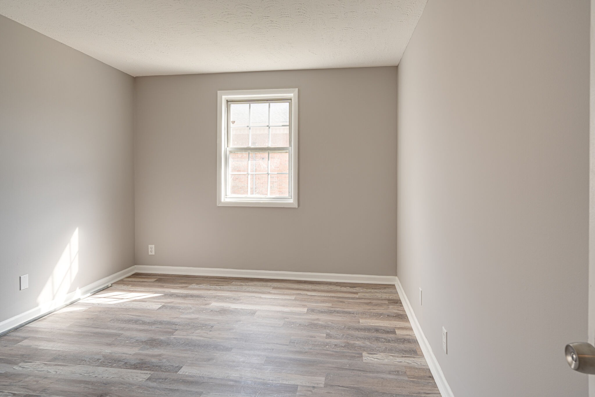 323 Forest Park Road, Unit 76 Madison, TN 37115 - Photo 10 of 15 an empty room with wooden floor and windows
