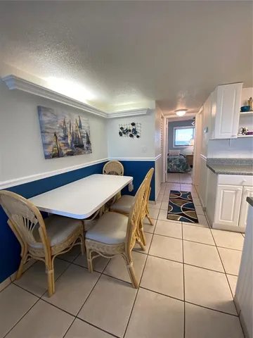 a bedroom with a bed and a lamp