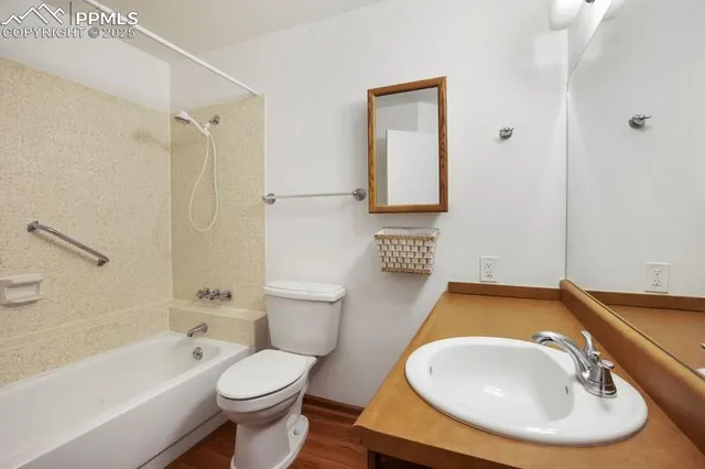 a bathroom with a sink a toilet and a bathtub