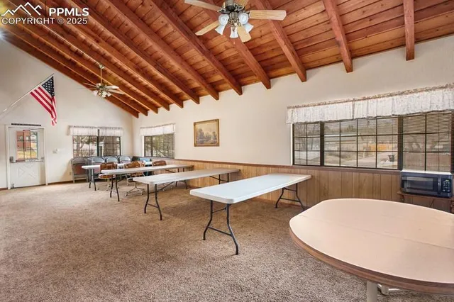 a living room with lots of furniture and a rug