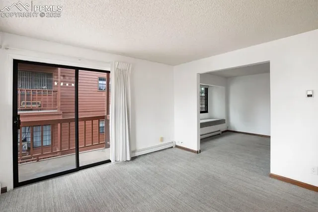 an empty room with sliding door